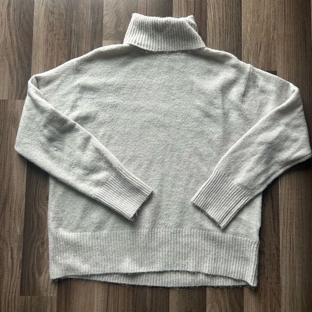 Oversized turtle neck sweater in a light cream/oatmeal color
